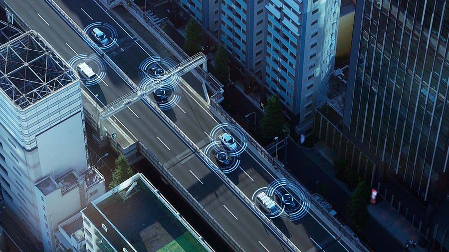 Illustration of city streets seen from above with cars on road and circles of sensors around each car.