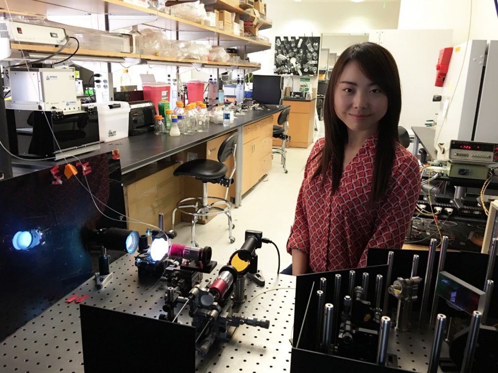 UCLA Dr. Claire Chen with microscope